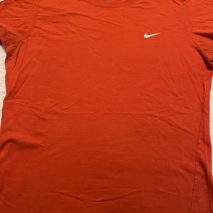 Women’s Nike large slim fit shirt. Good condition, color, orange.